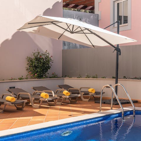 Relax in the shade or sun by the private pool
