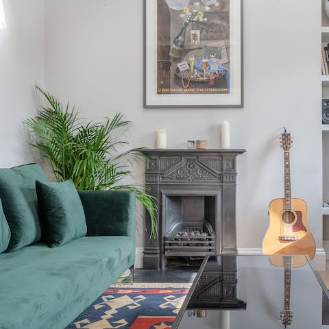 Make yourself comfortable in the bright living room while enjoying a jam session on the guitar
