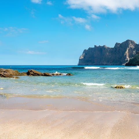 Drive down to one of Pollenca's stunning beaches 