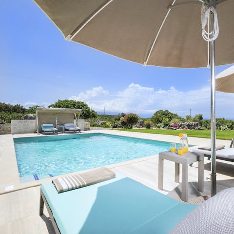 Soak up the Greek sun from in or beside the private pool