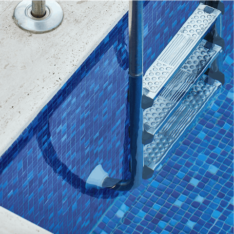 Cool off in the outdoor swimming pool in the courtyard