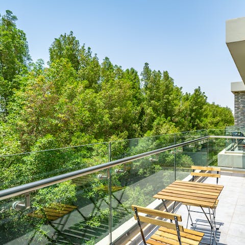 Relax on your balcony in the sunshine, surrounded by lush greenery