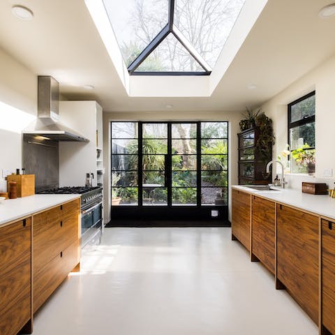 Enjoy cooking in the bright kitchen with stylish skylights and crittall-style doors