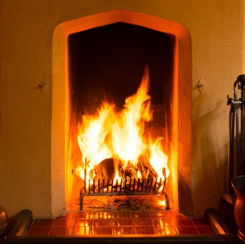 Get a fire crackling in the grate to keep the place cosy
