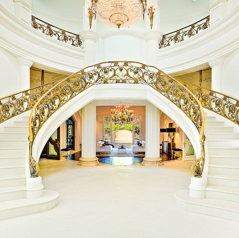 Make an impressive entrance as you descend the sweeping staircase