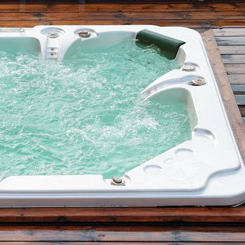 Soak in the outdoor hot tub