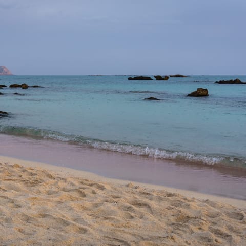 Sink your feet into the sand at Stavromenos beach, just 2km away