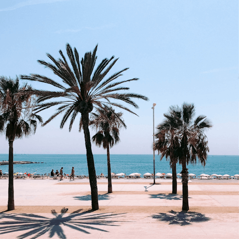 Hop in a taxi for a fifteen-minute drive down to Barceloneta Beach