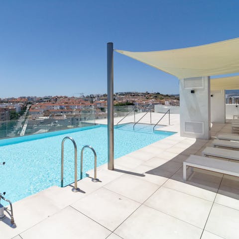 Enjoy the stunning views and the glistening waters of the communal pool 