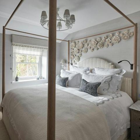 Enjoy a well-deserved rest in the gorgeous four-poster bed