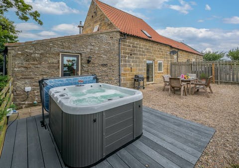 Relax in the private hot tub after a busy day exploring the local area