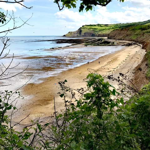 Stroll along the shoreline at Robin Hood's Bay