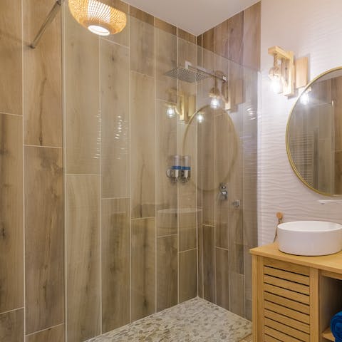 Wash off the sand and sea water in your luxurious rain shower before getting ready for dinner