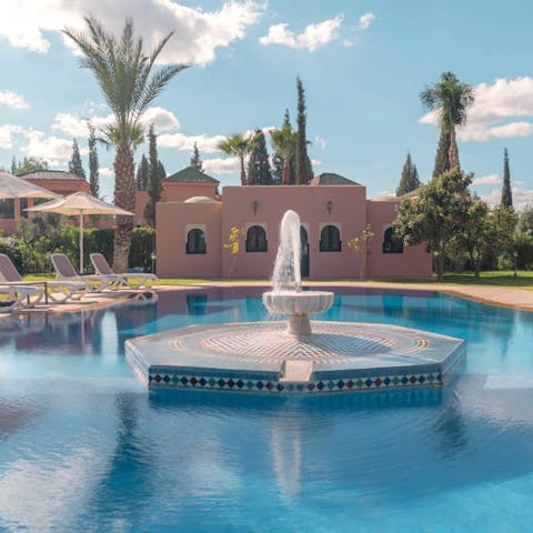 Enjoy a picturesque swim around the water fountain 