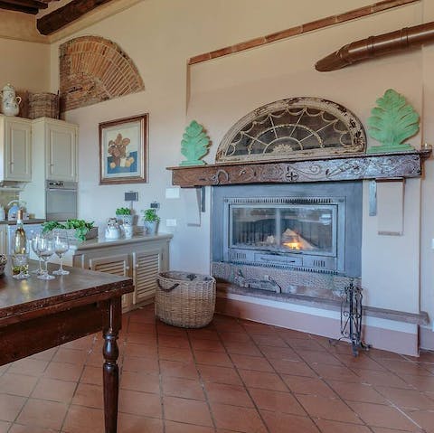 Warm up by the kitchen's historic feature fireplace