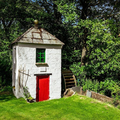 Explore the picturesque grounds, complete with water mill