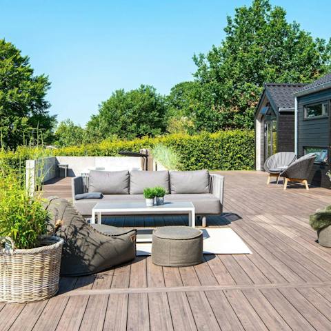 Sip your morning coffee on the comfy outdoor sofa 