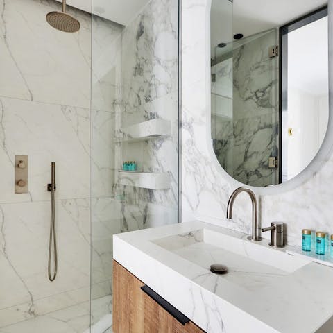 Get ready for an evening out in Paris in the chic, marble-style bathrooms