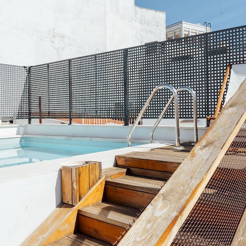 Soak up some sun by the inviting rooftop pool