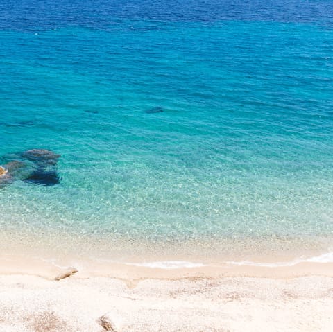 Spend sun-drenched days at the beautiful Ornos Beach, only minutes away