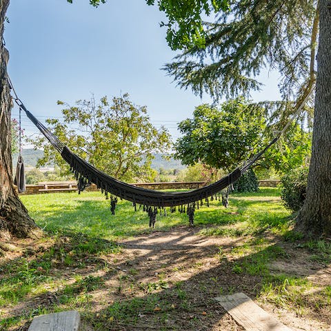 Spend lazy days on the hammock strung between ancient trees