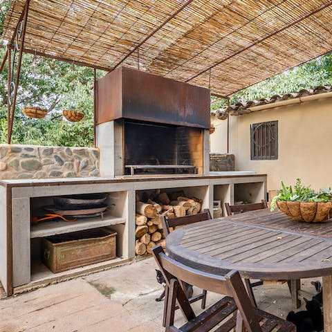 Cook a rustic feast at the wood-fired outdoor kitchen