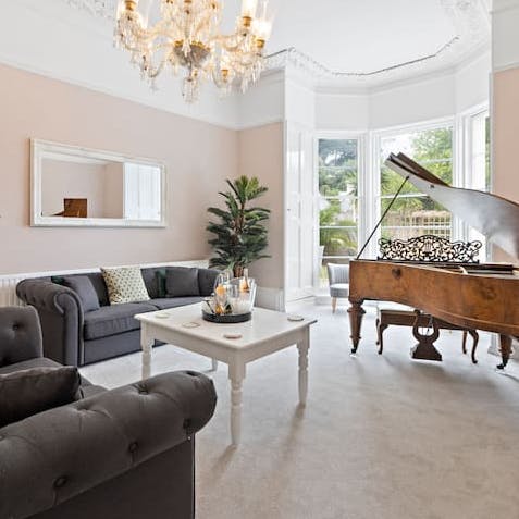 Enjoy a moment of calm as you sip tea in the living area by the grand piano