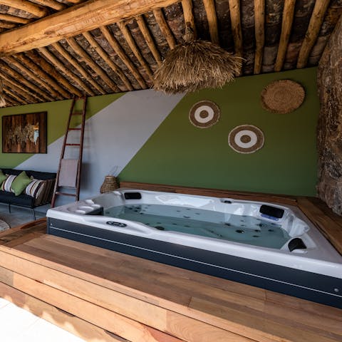 Bring out a bottle of wine and sink into the bubbling hot tub for ultimate relaxation