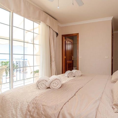 Draw the curtains in the main bedroom and step out onto the private balcony to greet the sun