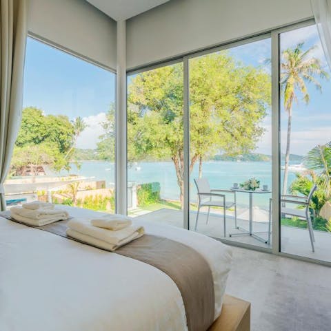 Wake up to beachy views thanks to floor-to-ceiling windows in the bedrooms