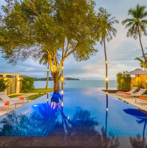 Slip into the cooling waters of your infinity pool for a sunset swim