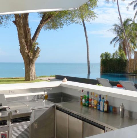 Knock up a round of cocktails at the fully-stocked poolside bar