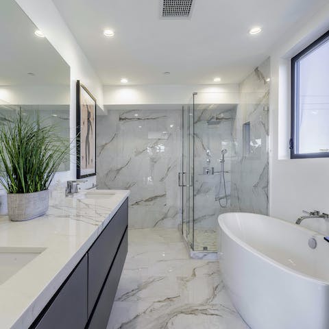 Treat yourself to a restorative soak in the spa-standard bathroom