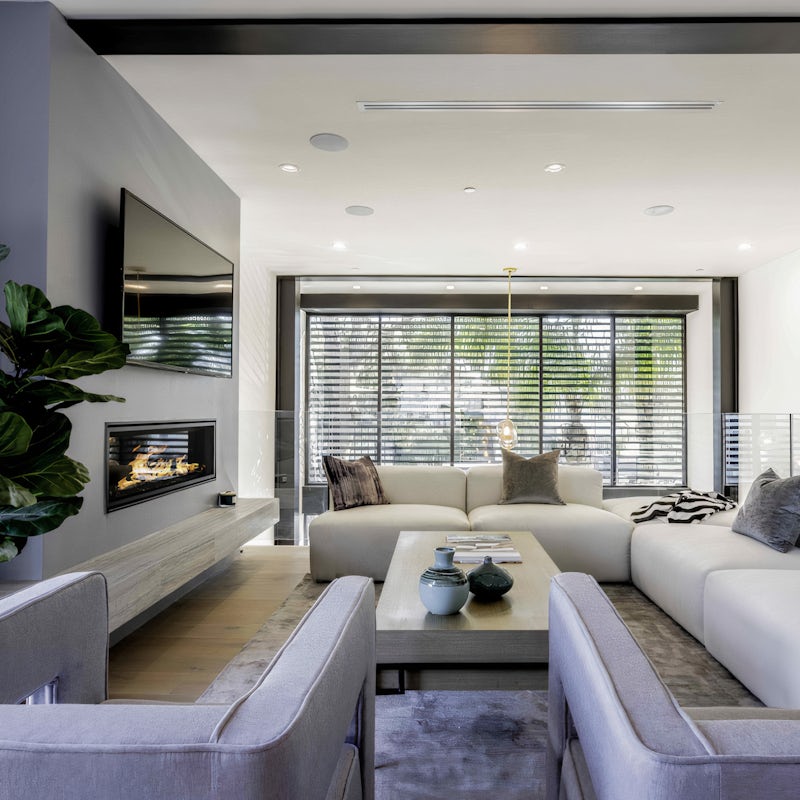 Gather everybody around the contemporary fireplace in the living room and put a movie on