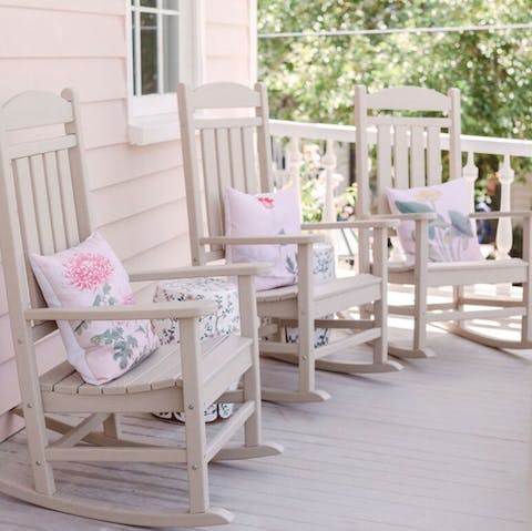 Watch the world go by from the pretty pastel veranda