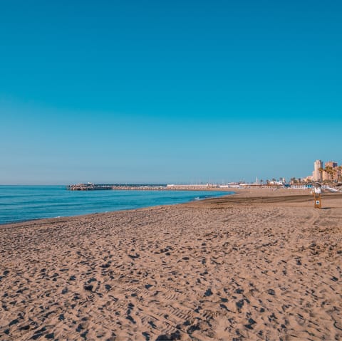 Walk to Playa de la Torre for a day on the sand