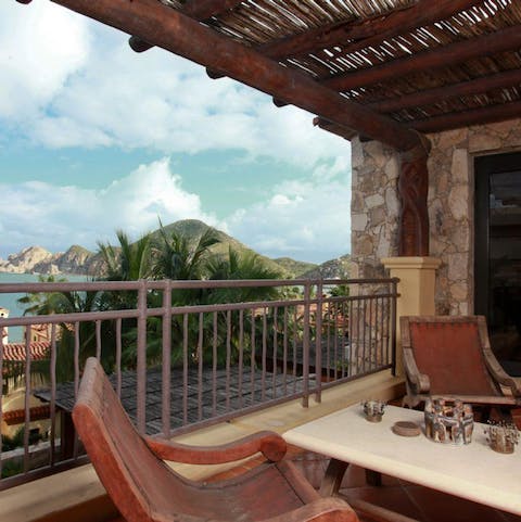 Enjoy your morning coffee on your private balcony, overlooking the crystal waters