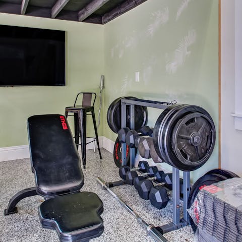 Work up a sweat thanks to the gym equipment in the garage