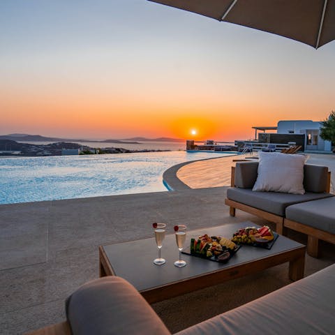 Watch the sunset over the sparkling seascape from the terrace 