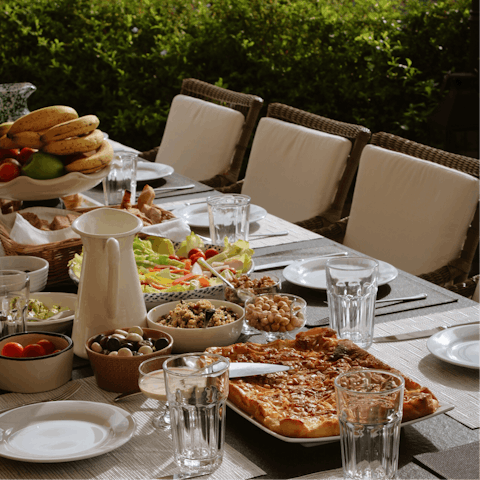 Dine alfresco on the cosy outdoor table