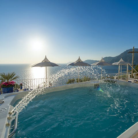 Ease yourself into the hot tub to relax with an ocean view