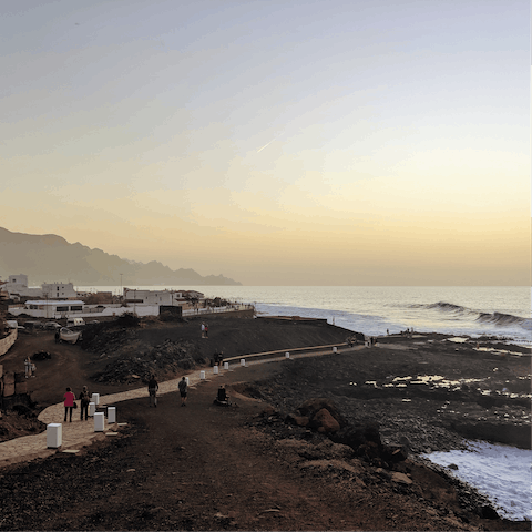 Explore the black sand beach of Meloneras - only a 15 minute walk away