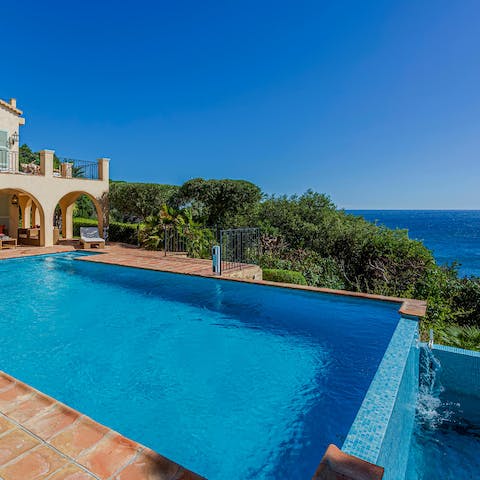 Float in the infinity pool overlooking the Mediterranean