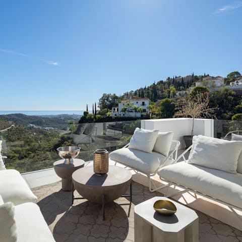 Savour evening drinks as the sun sets over Benahavis