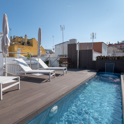 Enjoy relaxing afternoons laid out by the rooftop pool