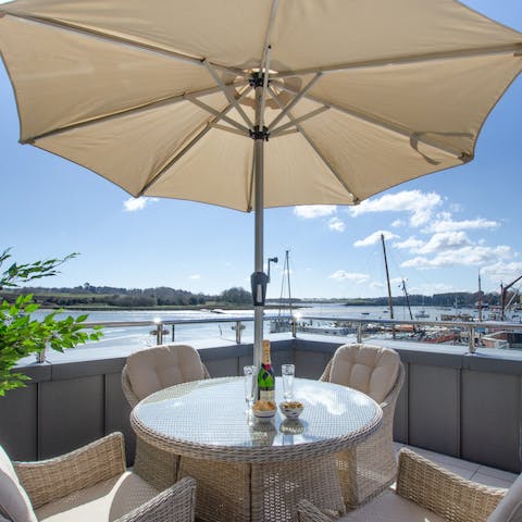 Dine alfresco as you watch the yachts sail by