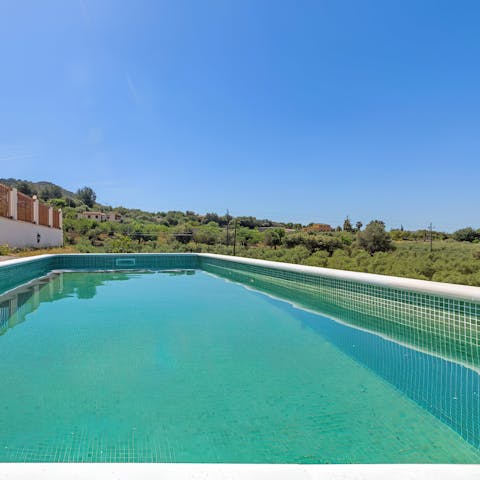 Swim in the private pool, surrounded by nature
