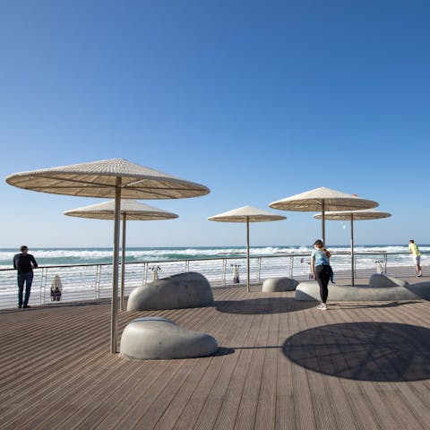 Watch the waves roll in at Banana Beach, a twenty minute walk away