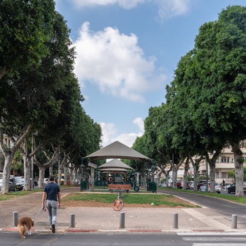 Step out of your building and turn right onto the charming Rothschild Boulevard