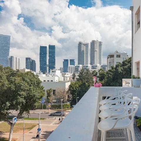 Enjoy a coffee on the balcony overlooking Tel Aviv